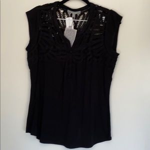 New with tags top. Lovely cut out detailing